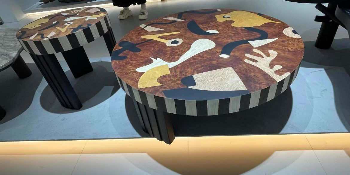 A wooden table featuring abstract art design