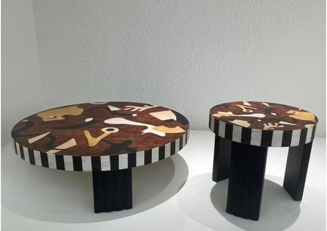 A wooden table featuring abstract art design