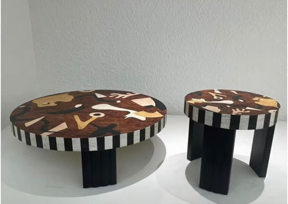A wooden table featuring abstract art design